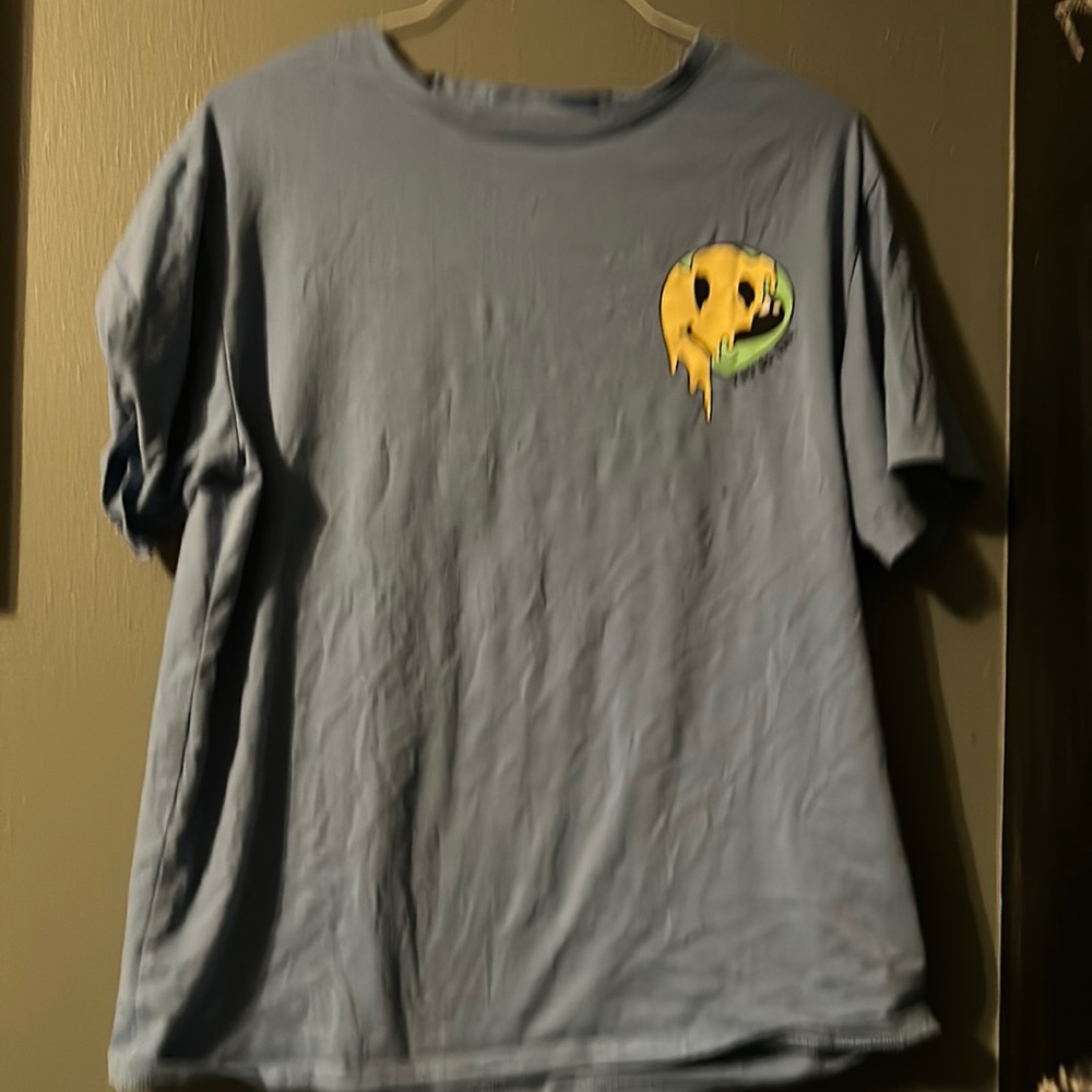 Blue t shirt with melting smiley face